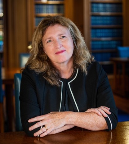 A photo of Tana Adkin KC seated and facing the camera