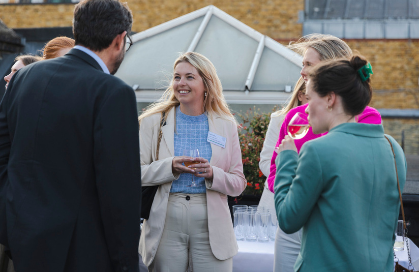 A photo of people talking outside 