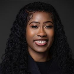 Profile head and shoulders photograph of Ife Thompson