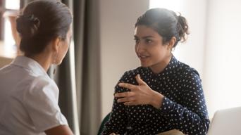 Two women in discussion