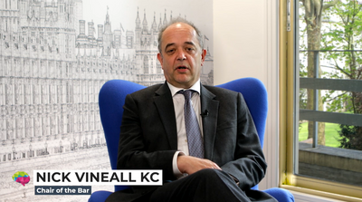 Nick Vineall KC sitting in a blue chair speaking. The text says: Nick Vineall KC, Chair of the Bar