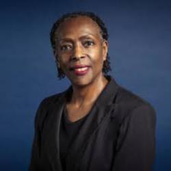 Profile head and shoulders photograph of Anesta Weekes KC