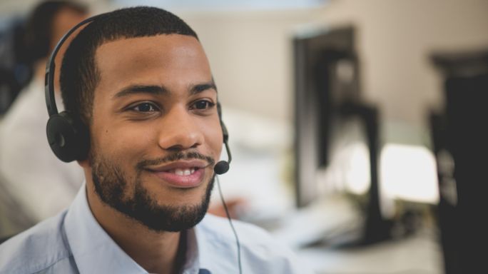 A man on a call with a headset