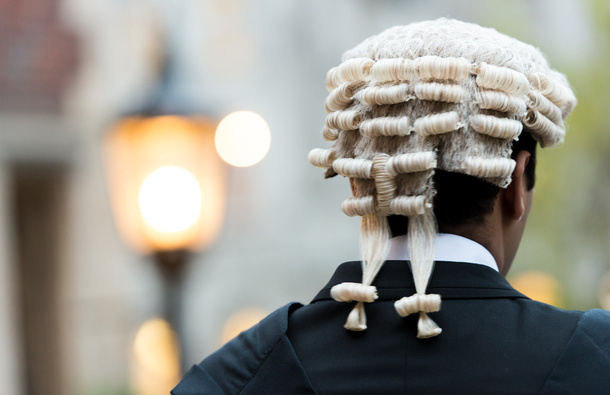 Barristers wearing a wig and gown from the back