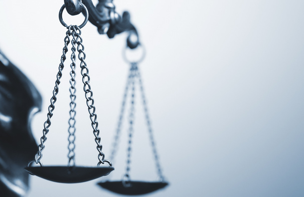 Lady Justice scales close up.