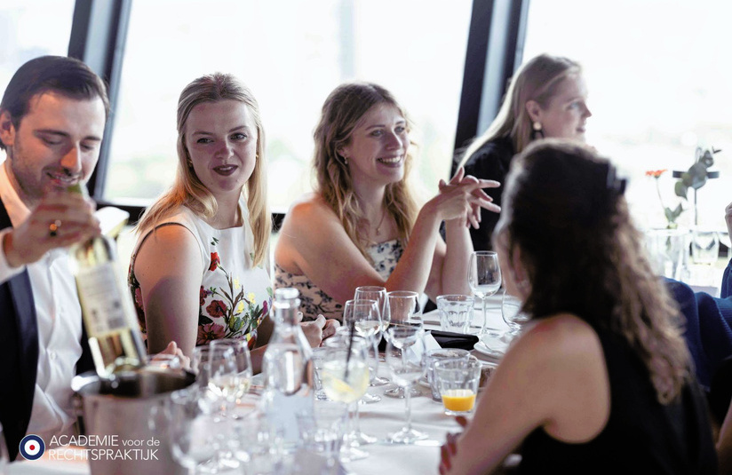 A photo  of people sitting at a dining table