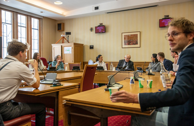 A photo of people sitting at tables