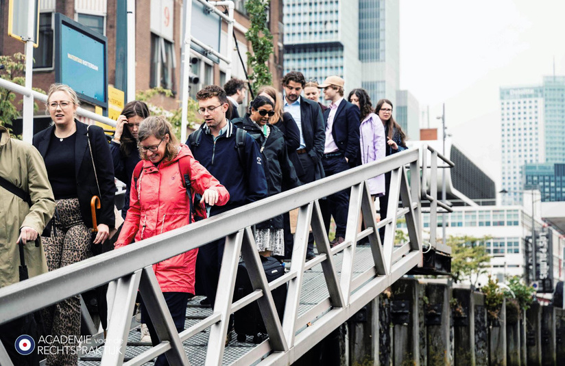 A photo of a group of people descending a gangway