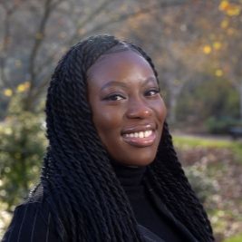 Profile photograph of Enehuwa Adagu smiling