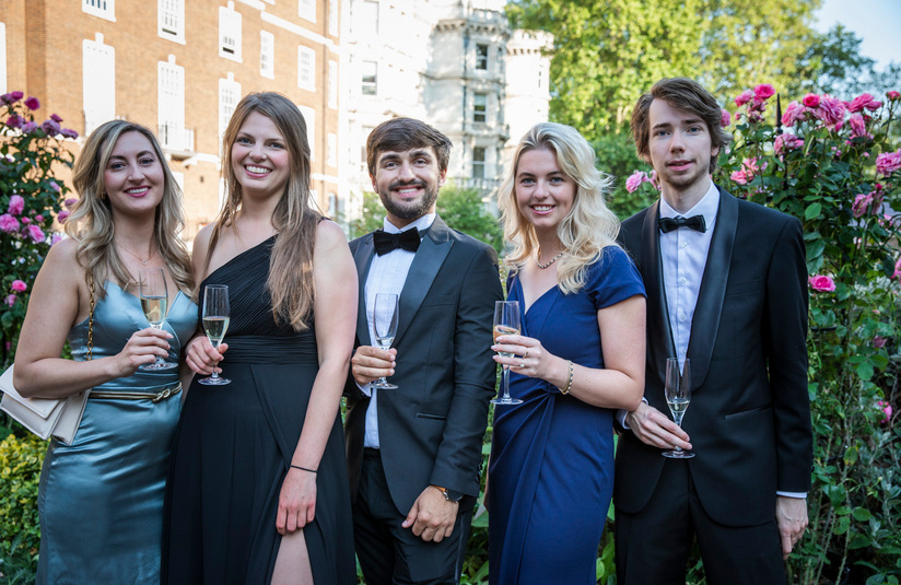 A photo of dressed up people outside