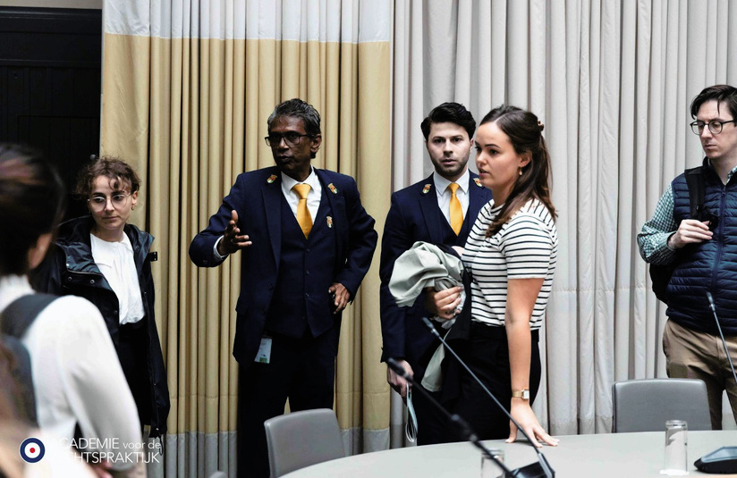 A photo of a group of people talking